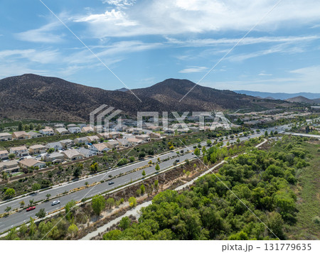 Aerial view of a sprawling neighborhood of family homes in Menifee, California, USA. Aerial view of a sprawling neighborhood of family homes in Menifee, California, USA. 131779635