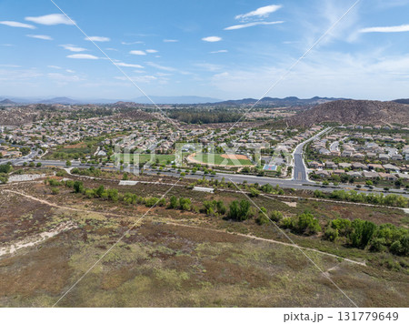 Aerial view of a sprawling neighborhood of family homes in Menifee, California, USA. Aerial view of a sprawling neighborhood of family homes in Menifee, California, USA. 131779649