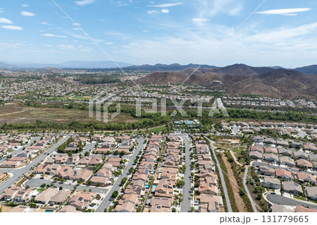 Aerial view of a sprawling neighborhood of family homes in Menifee, California, USA. Aerial view of a sprawling neighborhood of family homes in Menifee, California, USA. 131779665