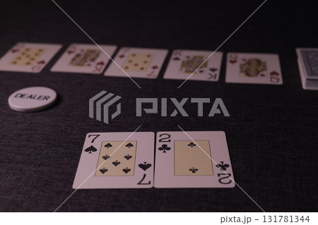 the poker game in casino chips cards and the poker table 131781344