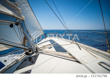 Sailing yacht moving at full speed with all sails up in the open sea near Croatia. Dynamic maritime adventure and freedom of ocean travel. 131782796