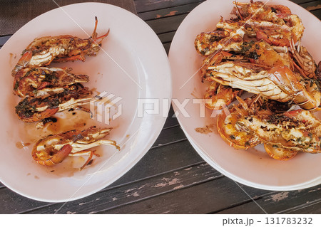 Grilled lobsters with garlic sauce. 131783232