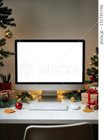 Christmas Desktop Computer Mockup with Blank Screen Surrounded by Festive Workspace Elements 131785746