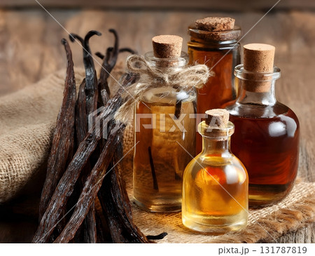 A still life composition featuring dried vanilla bean pods next to small glass bottles containing homemade vanilla extract or essential oil on burlap. AI Generated A still life composition featuring dried vanilla bean pods next to small glass bottles containing homemade vanilla extract or essential oil on burlap. AI Generated 131787819