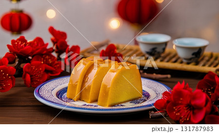 Sliced golden nian gao, traditional chinese new year cake, lunar new year celebration, asian holiday food Sliced golden nian gao, traditional chinese new year cake, lunar new year celebration, asian holiday food 131787983