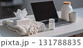 Office Desk with Tissues, Medicine, and Laptop for Remote Work During Illness 131788835