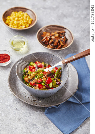 Quinoa with green beans, tomatoes, fried champignons, corn, red bell peppers, peas and soybeans. Healthy Vegetable Mix Quinoa with green beans, tomatoes, fried champignons, corn, red bell peppers, peas and soybeans. Healthy Vegetable Mix 131788843