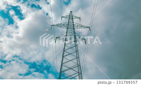 High Voltage Power Line Stretching Across The Dramatic Sky With Clouds And Sunlight High Voltage Power Line Stretching Across The Dramatic Sky With Clouds And Sunlight 131789357