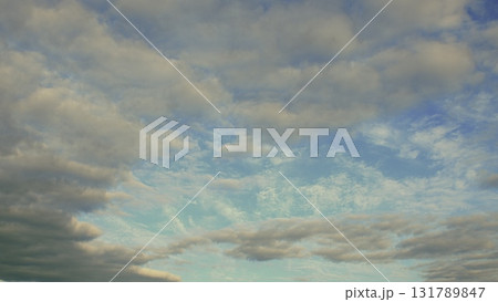 A Serene and Beautiful Sky with Fluffy, White Clouds and Soft, Illuminating Light A Serene and Beautiful Sky with Fluffy, White Clouds and Soft, Illuminating Light 131789847