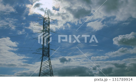 A Powerline Stands Out Against a Dramatic and Colorful Sky Filled with Clouds and Light A Powerline Stands Out Against a Dramatic and Colorful Sky Filled with Clouds and Light 131789914