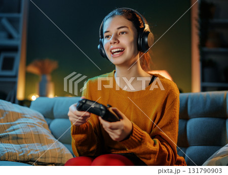 woman is playing video game woman is playing video game 131790903