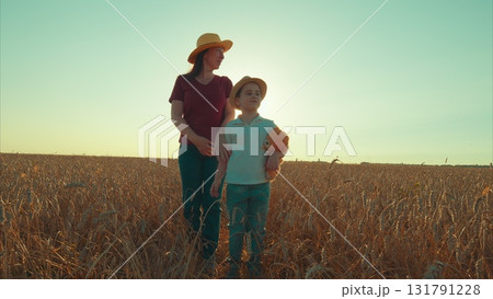 Joyful and unforgettable Moments in a Bright Sunlit Field with Loving Mother and Child 131791228