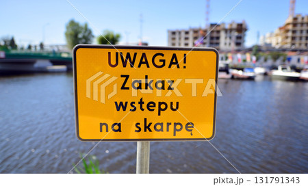 Szczecin, Poland. 16 July 2025. Urban landscape. Sign with the inscription: Uwaga! Zakaz wstepu na skarpe. 131791343