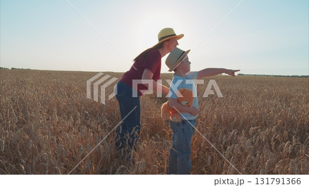 An Adventurous and Joyful Day Spent in the Expansive Wheat Field with a Happy Little Child An Adventurous and Joyful Day Spent in the Expansive Wheat Field with a Happy Little Child 131791366
