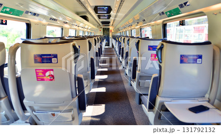 Warsaw, Poland. 15 July 2025. Interior of a passenger train. Empty chairs in the wagon. PKP Intercity. Interior of a Pendolino carriage. 131792132