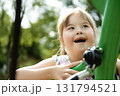 A portrait of trisomie 21 child girl outside having fun on a park 131794521