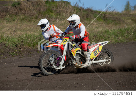 Sidecar racing motocross on dusty track 131794651