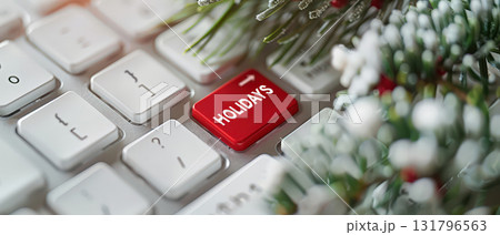 White computer keyboard with red holidays key and festive decorations White computer keyboard with red holidays key and festive decorations 131796563