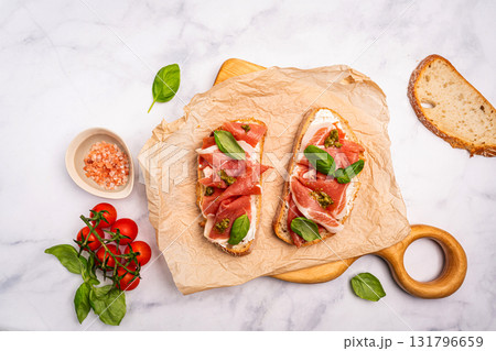 Grilled toast with jamon or prosciutto 131796659