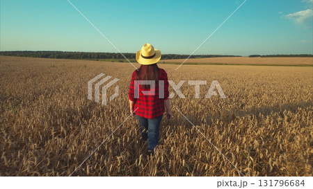 Embracing the Beauty of Nature Enjoying a Stroll Through Golden Fields During the Summer Embracing the Beauty of Nature Enjoying a Stroll Through Golden Fields During the Summer 131796684