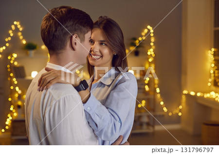Young couple in love Saint Valentine's Day celebration, smiling, close hug cuddle in modern studio Young couple in love Saint Valentine's Day celebration, smiling, close hug cuddle in modern studio 131796797