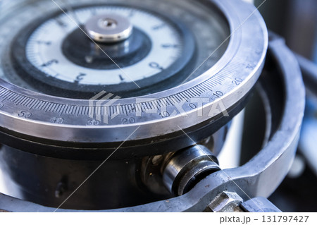 A detailed close-up of a circular dial gauge of a gyrocompass A detailed close-up of a circular dial gauge of a gyrocompass 131797427