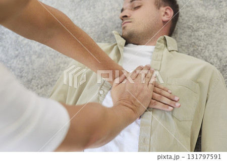 CPR emergency training, resuscitation compressions for first aid lifesaving of man 131797591
