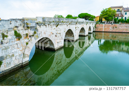 Tiberius Bridge over the river in Rimini. Italian classical architecture. A city landmark. 131797757