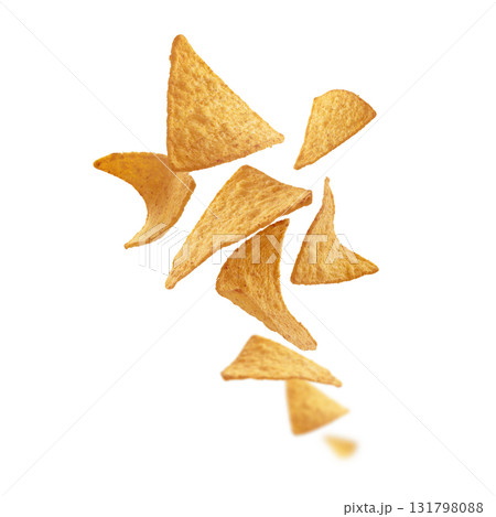 Corn chips of triangular shape levitate on a white background Corn chips of triangular shape levitate on a white background 131798088