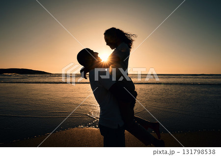 Love, silhouette and sunset with couple at beach for romance, affectionate and summer. Travel, happy and vacation with man and woman hugging for anniversary date, marriage and support on holiday Love, silhouette and sunset with couple at beach for romance, affectionate and summer. Travel, happy and vacation with man and woman hugging for anniversary date, marriage and support on holiday 131798538