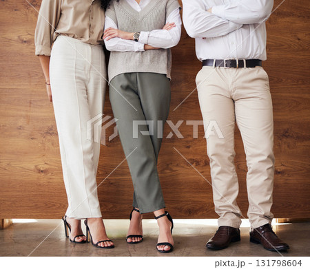 Standing, office and legs of business people with arms crossed for an interview, meeting or teamwork. Together, corporate and employees at work for success, collaboration or group solidarity Standing, office and legs of business people with arms crossed for an interview, meeting or teamwork. Together, corporate and employees at work for success, collaboration or group solidarity 131798604