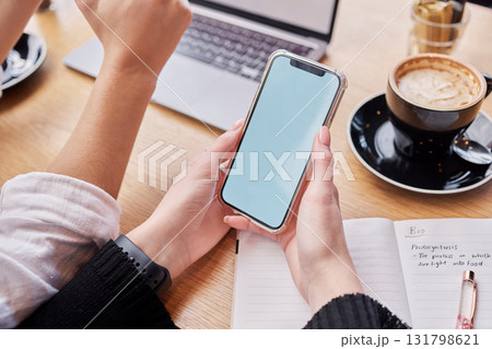 Search, phone screen and mockup with hands of woman in coffee shop for social media, technology and research. Digital, website and networking app with student in cafe for remote study and contact Search, phone screen and mockup with hands of woman in coffee shop for social media, technology and research. Digital, website and networking app with student in cafe for remote study and contact 131798621