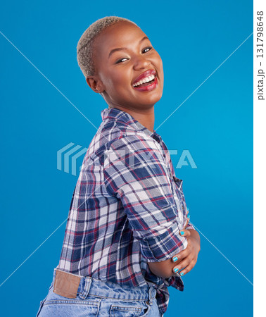 Happy, smile and portrait of black woman with confidence, happiness and empowerment in studio. Fashion, beauty and girl model laughing on blue background with pride, positive mindset and motivation Happy, smile and portrait of black woman with confidence, happiness and empowerment in studio. Fashion, beauty and girl model laughing on blue background with pride, positive mindset and motivation 131798648