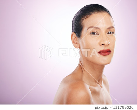Face, makeup and red lipstick of woman in studio isolated on a purple background mockup. Skincare, cosmetics and portrait, serious and mature female model with lip gloss for skin aesthetic and beauty Face, makeup and red lipstick of woman in studio isolated on a purple background mockup. Skincare, cosmetics and portrait, serious and mature female model with lip gloss for skin aesthetic and beauty 131799026