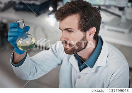 Science, study or scientist in laboratory with chemical liquid after chemistry research or scientific testing. Physics analysis, man or medical doctor with acid solution for medicine development 131799048