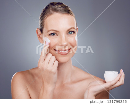 Cream, jar and woman skincare for face, smile or cosmetics on studio background. Facial portrait, beauty lotion and model with container of healthy glow, mature shine and advertising aesthetic makeup Cream, jar and woman skincare for face, smile or cosmetics on studio background. Facial portrait, beauty lotion and model with container of healthy glow, mature shine and advertising aesthetic makeup 131799236