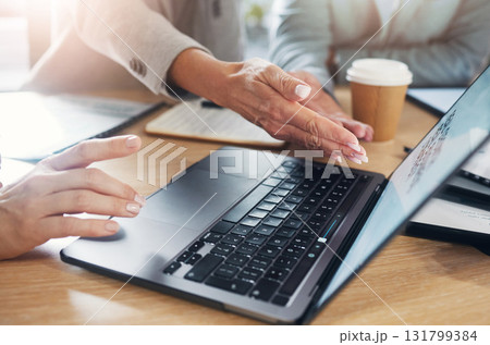 Hands, team and laptop for planning, research and creative collaboration by women in an office. Business people, design and meeting for online project, proposal and teamwork, strategy and review 131799384