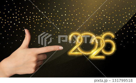 Elegant golden 2026 with female hand and sparkling decoration. Copy space 131799518