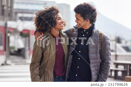 Love, smile and hug with black couple in city for romance, travel and happy on date. Care, vacation and commitment with man and woman walking in urban town with afro, partner and wellness 131799626