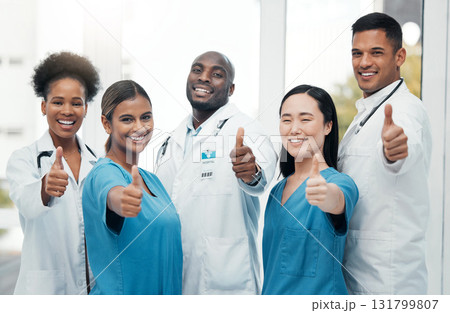 Nurses, doctors and thumbs up portrait of healthcare team for success, support and thank you. Hand sign of diversity women and men happy for medical teamwork in hospital with trust and care Nurses, doctors and thumbs up portrait of healthcare team for success, support and thank you. Hand sign of diversity women and men happy for medical teamwork in hospital with trust and care 131799807