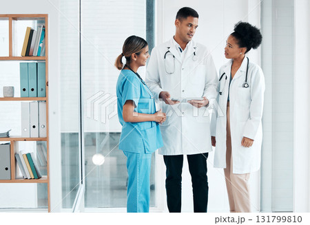 Doctors, nurse and tablet for healthcare team planning care, discussion or meeting about medical research. Women and man with app talking for communication, online consultation and advice in hospital 131799810