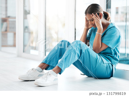 Depression, headache and medical with nurse on floor of hospital for sad, mental health and burnout. Anxiety, stress and frustrated with tired woman in clinic for healthcare, medicine and nursing Depression, headache and medical with nurse on floor of hospital for sad, mental health and burnout. Anxiety, stress and frustrated with tired woman in clinic for healthcare, medicine and nursing 131799819