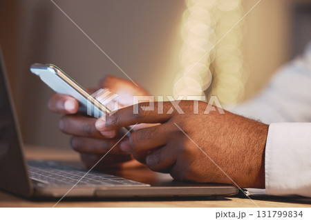 Business man, hands and phone by a laptop typing a message for work networking. Hand closeup, bokeh and online management of a employee working and planning a job schedule with technology and email Business man, hands and phone by a laptop typing a message for work networking. Hand closeup, bokeh and online management of a employee working and planning a job schedule with technology and email 131799834