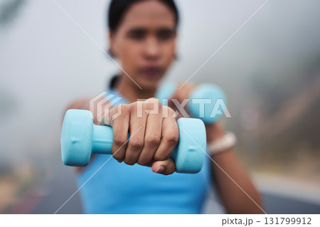 Woman, hand with weightlifting and fitness, dumbbell and closeup with muscle training outdoor in street. Exercise, strong female and fist, healthy and active lifestyle with weights and wellness Woman, hand with weightlifting and fitness, dumbbell and closeup with muscle training outdoor in street. Exercise, strong female and fist, healthy and active lifestyle with weights and wellness 131799912