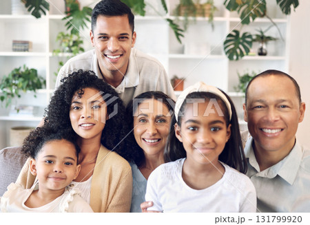 Family in happy portrait with kids, parents and grandparents on sofa with smile in home in Brazil. Happiness, generations of men and women with children, people spending time together making memories Family in happy portrait with kids, parents and grandparents on sofa with smile in home in Brazil. Happiness, generations of men and women with children, people spending time together making memories 131799920