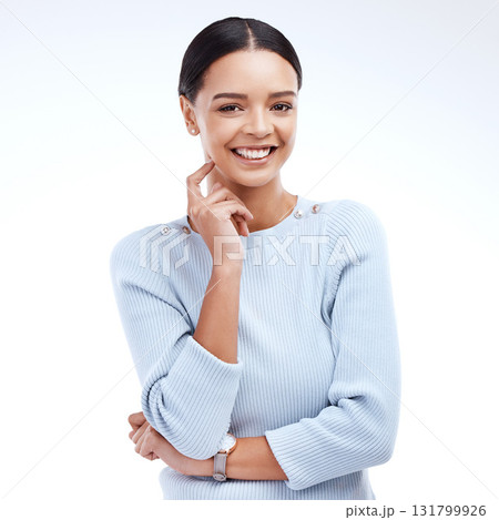 Portrait, empowerment and smile with a woman on a white background isolated in studio while looking positive. Idea, happy and an attractive young female standing hand on chin for cheerful happiness 131799926