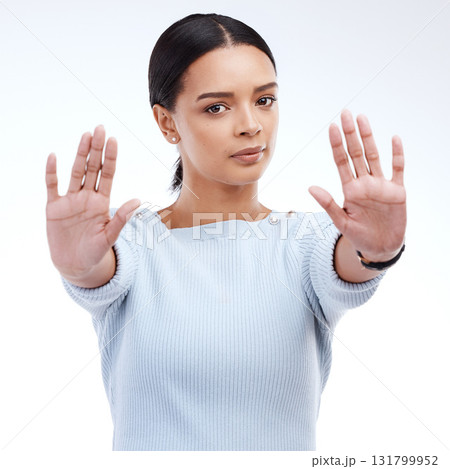 Portrait, stop and woman with hands, warning and human rights isolated on a white studio background. Face, female activist and person with gesture for protest, protection and rejection with awareness 131799952