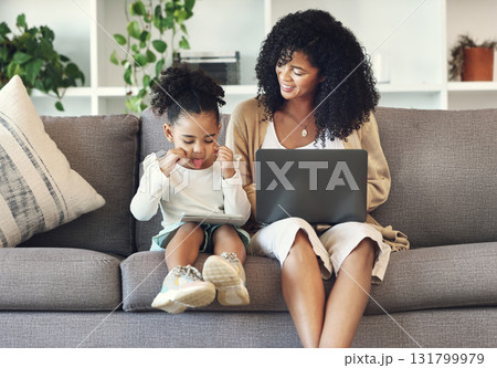 Black family, child and funny selfie with technology on home couch for remote work or online education. Woman or mother and kid on tablet and laptop internet for learning development, games and movie 131799979