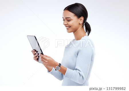 Woman, tablet and reading in studio by white background for planning, schedule and smile for website. Girl, student and excited on mobile touchscreen app for research, calendar or social network chat Woman, tablet and reading in studio by white background for planning, schedule and smile for website. Girl, student and excited on mobile touchscreen app for research, calendar or social network chat 131799982