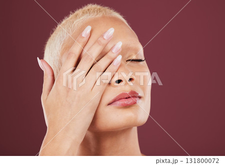 Eyes closed, hands and face skincare of woman in studio isolated on a red background mockup. Dermatology, makeup cosmetics and beauty of female model satisfied after facial treatment for healthy skin 131800072
